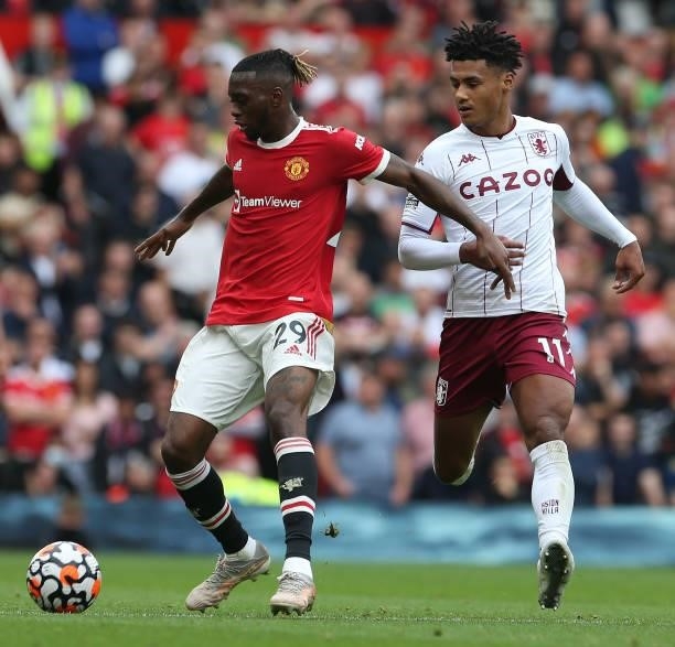 Aaron Wan-Bissaka of Manchester United in action with Ollie Watkins of Aston Villa during the Premier League match between Manchester United and...