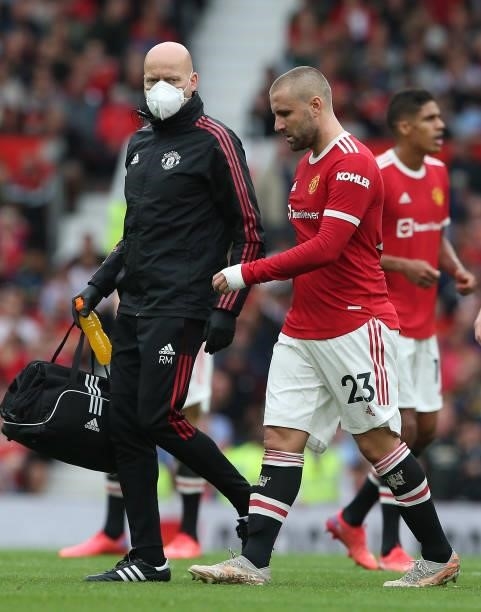 Luke Shaw of Manchester United leaves the match with an injury during the Premier League match between Manchester United and Aston Villa at Old...