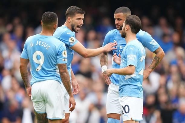 Ruben Dias of Manchester City interacts with Gabriel Jesus of Manchester City, Bernardo Silva of Manchester City and Kyle Walker of Manchester City...