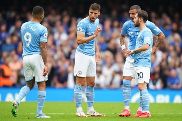 Ruben Dias of Manchester City interacts with Gabriel Jesus of Manchester City, Bernardo Silva of Manchester City and Kyle Walker of Manchester City...