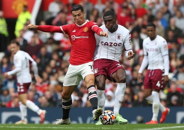 Cristiano Ronaldo of Manchester United in action with Kortney Hause of Aston Villa during the Premier League match between Manchester United and...