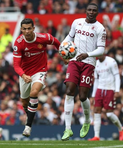 Cristiano Ronaldo of Manchester United in action with Kortney Hause of Aston Villa during the Premier League match between Manchester United and...