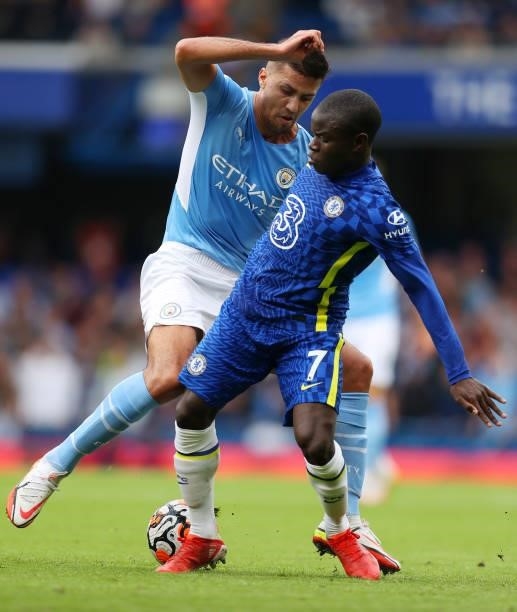 Ngolo Kante of Chelsea is put under pressure by Rodri of Manchester City during the Premier League match between Chelsea and Manchester City at...