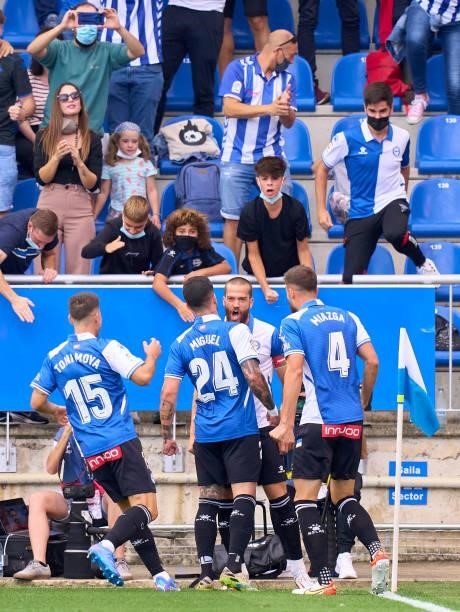 Victor Laguardia of Deportivo Alaves celebrates with team mates after scoring his team's first goal during the La Liga Santander match between...