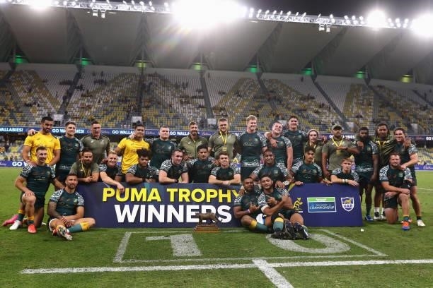 The Wallabies pose with the Puma Trophy after winning The Rugby Championship match between the Australian Wallabies and Argentina Pumas at QCB...
