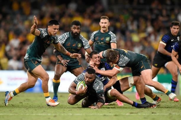 Samu Kerevi of the Wallabies is tackled during The Rugby Championship match between the Australian Wallabies and Argentina Pumas at QCB Stadium on...