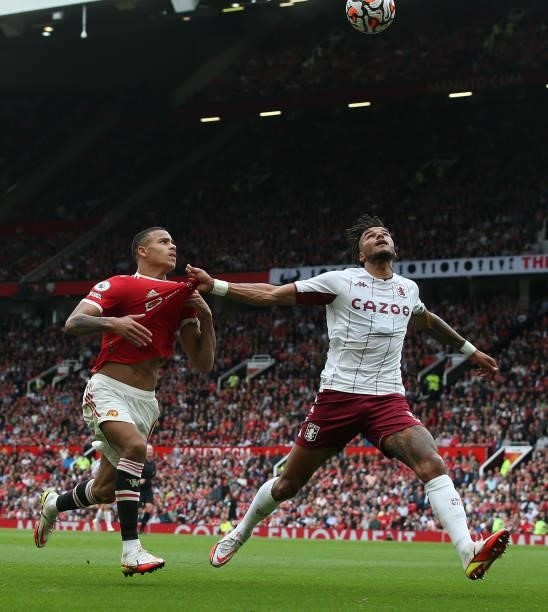Mason Greenwood of Manchester United in action with Tyrone Mings of Aston Villa during the Premier League match between Manchester United and Aston...