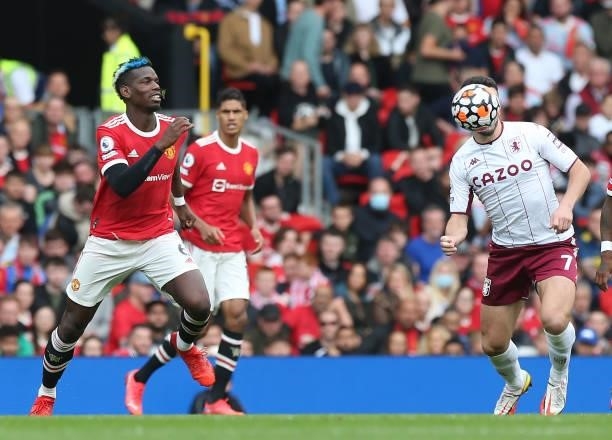 Paul Pogba of Manchester United in action with John McGinn of Aston Villa during the Premier League match between Manchester United and Aston Villa...