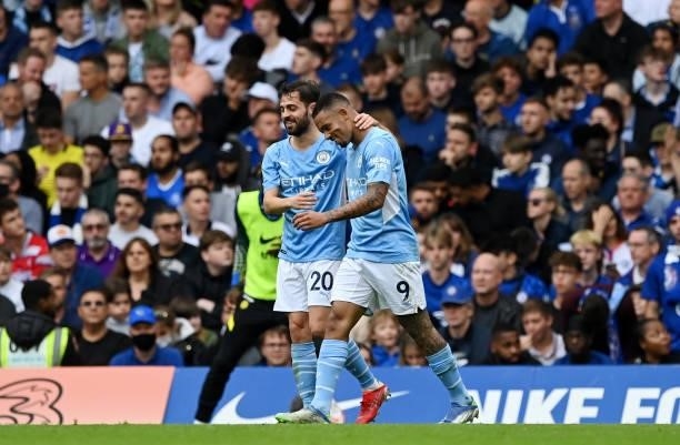 Gabriel Jesus of Manchester City celebrates with teammate Bernardo Silva after scoring their team's first goal during the Premier League match...