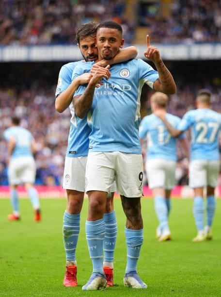 Gabriel Jesus of Manchester City celebrates with teammate Bernardo Silva after scoring their team's first goal during the Premier League match...