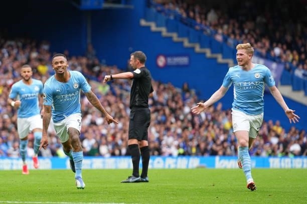 Gabriel Jesus of Manchester City celebrates with teammate Kevin De Bruyne after scoring their team's first goal during the Premier League match...
