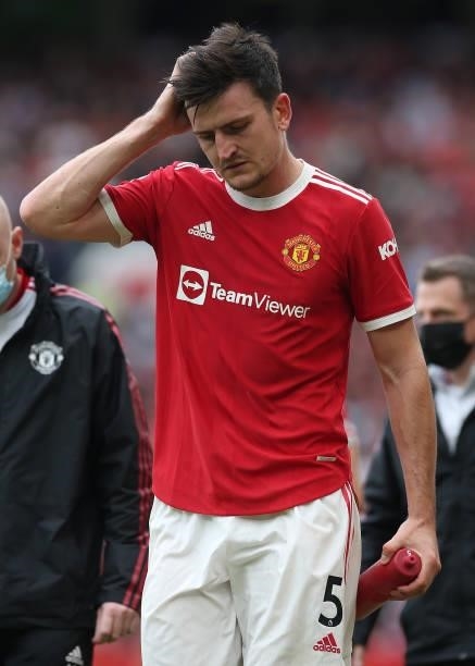 Harry Maguire of Manchester United leaves the match with an injury during the Premier League match between Manchester United and Aston Villa at Old...