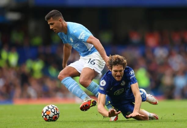 Rodrigo of Manchester City battles for possession with Marcos Alonso of Chelsea during the Premier League match between Chelsea and Manchester City...