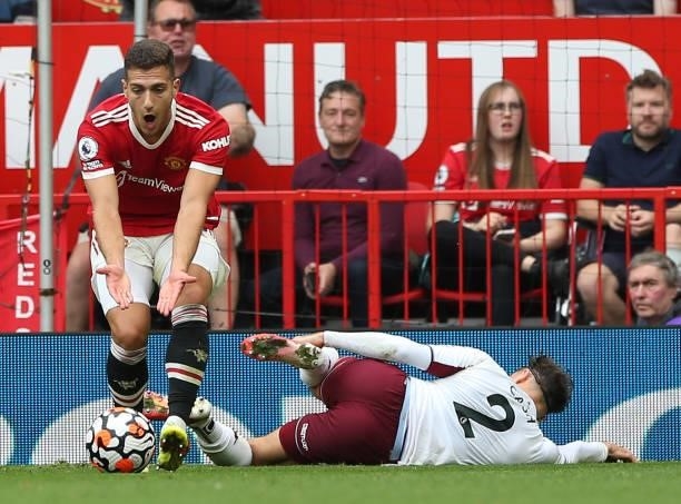 Diogo Dalot of Manchester United in action with Matty Cash of Aston Villa during the Premier League match between Manchester United and Aston Villa...