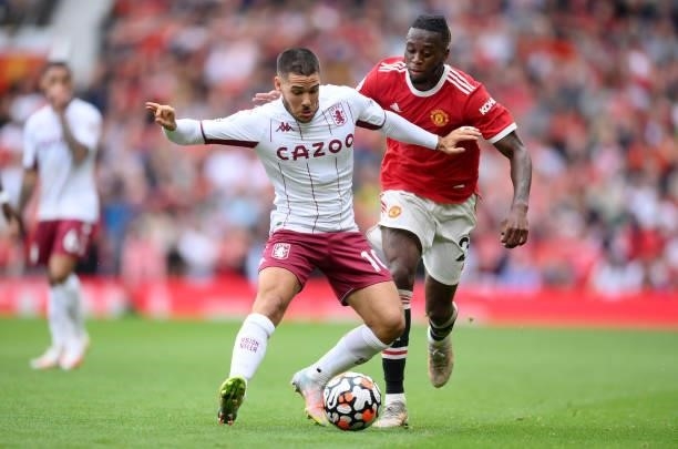 Emiliano Buendia of Aston Villa with Aaron Wan-Bissaka of Manchester United during the Premier League match between Manchester United and Aston Villa...
