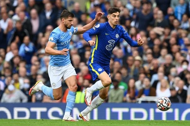 Kai Havertz of Chelsea battles for possession with Ruben Dias of Manchester City during the Premier League match between Chelsea and Manchester City...