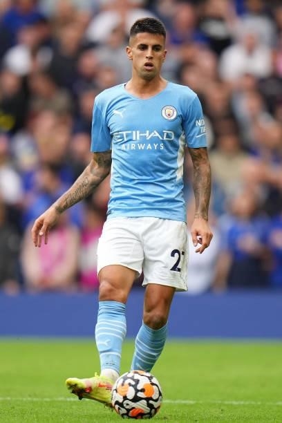 Joao Cancelo of Manchester City runs with the ball during the Premier League match between Chelsea and Manchester City at Stamford Bridge on...