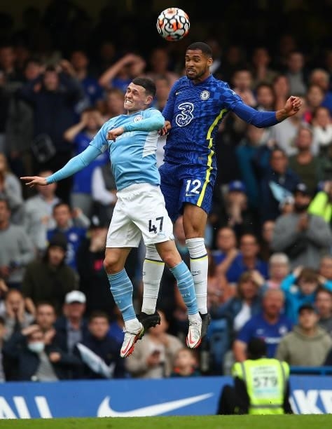 Phil Foden of Manchester City in the air with Ruben Loftus-Cheek of Chelsea during the Premier League match between Chelsea and Manchester City at...