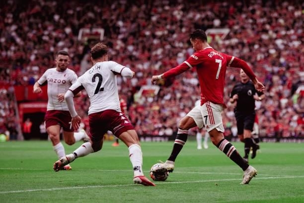 Cristiano Ronaldo of Manchester United in action with Matty Cash of Aston Villa during the Premier League match between Manchester United and Aston...