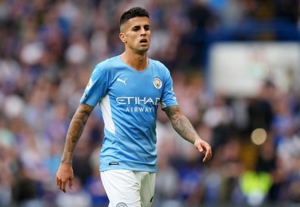 Joao Cancelo of Manchester City looks on during the Premier League match between Chelsea and Manchester City at Stamford Bridge on September 25, 2021...