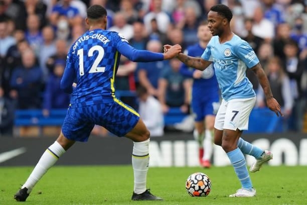 Raheem Sterling of Manchester City holds the ball whilst under pressure from Ruben Loftus-Cheek of Chelsea during the Premier League match between...