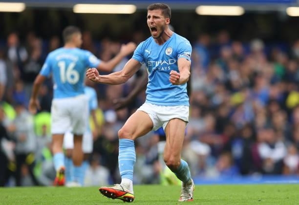 Ruben Dias of Manchester City celebrates following his team's victory in the Premier League match between Chelsea and Manchester City at Stamford...