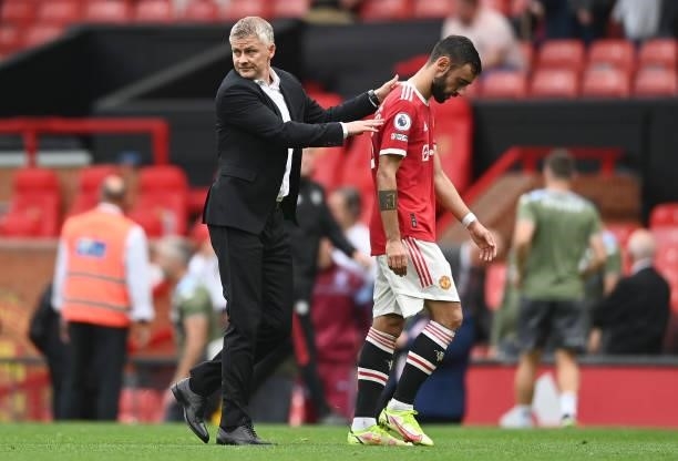 Ole Gunnar Solskjaer, Manager of Manchester United with Bruno Fernandes after the Premier League match between Manchester United and Aston Villa at...