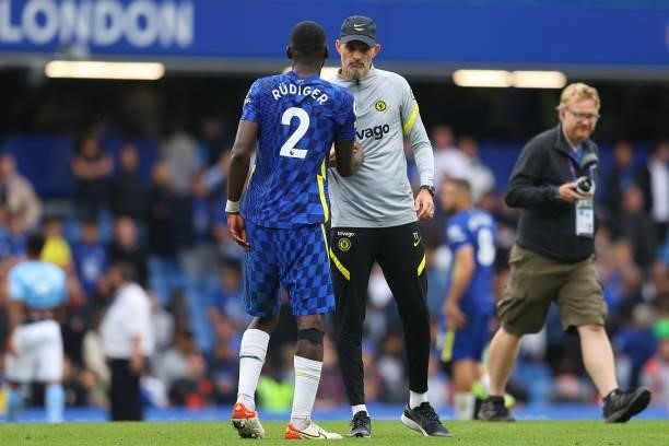 Thomas Tuchel, Manager of Chelsea interacts with Antonio Ruediger of Chelsea following during the Premier League match between Chelsea and Manchester...