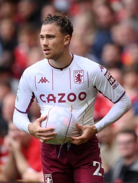 Matty Cash of Aston Villa puts the ball up his shirt during the Premier League match between Manchester United and Aston Villa at Old Trafford on...