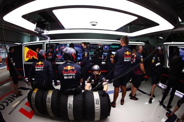 Red Bull Racing team members look on in the garage during qualifying ahead of the F1 Grand Prix of Russia at Sochi Autodrom on September 25, 2021 in...
