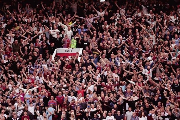 Aston Villa fans celebrate Kortney Hause of Aston Villa scoring their first goal during the Premier League match between Manchester United and Aston...