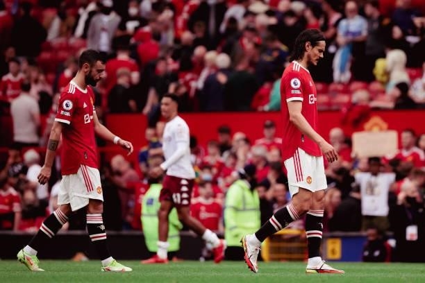 Bruno Fernandes and Edinson Cavani of Manchester United walks off after the Premier League match between Manchester United and Aston Villa at Old...