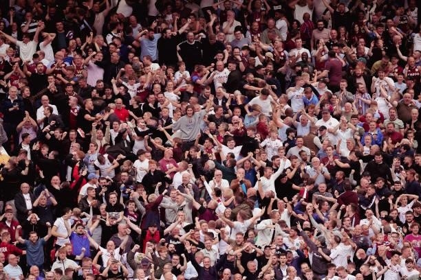 Aston Villa fans celebrate Kortney Hause of Aston Villa scoring their first goal during the Premier League match between Manchester United and Aston...