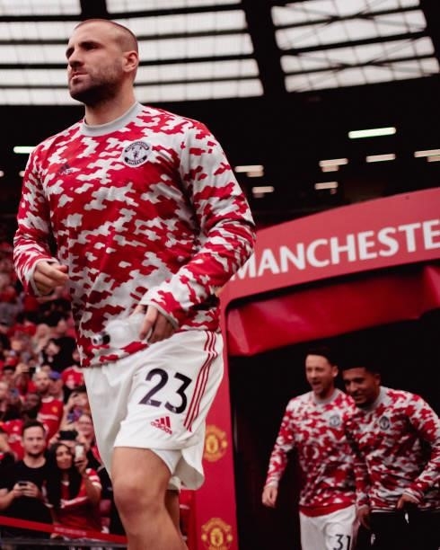 Luke Shaw of Manchester United warms up ahead of the Premier League match between Manchester United and Aston Villa at Old Trafford on September 25,...