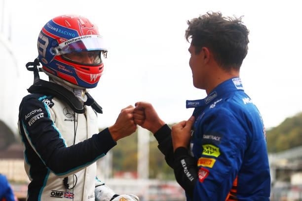 Pole position qualifier Lando Norris of Great Britain and McLaren F1 talks with third place qualifier George Russell of Great Britain and Williams in...