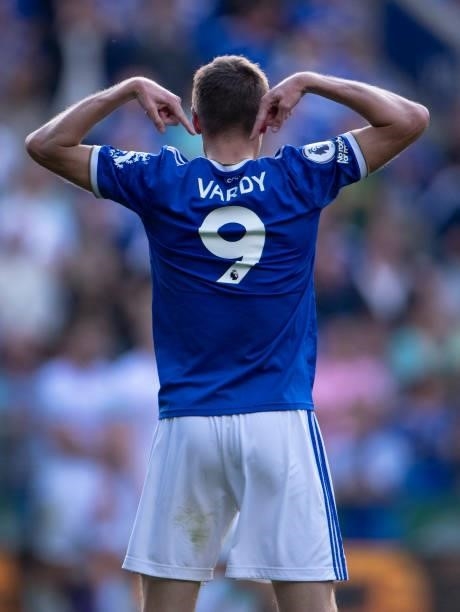 Jamie Vardy of Leicester City points to his name on the back of his shirt after scoring his second goal during the Premier League match between...