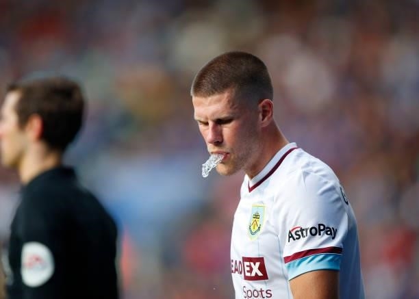 Johann Gudmunsson of Burnley spits water during the Premier League match between Leicester City and Burnley at The King Power Stadium on September...