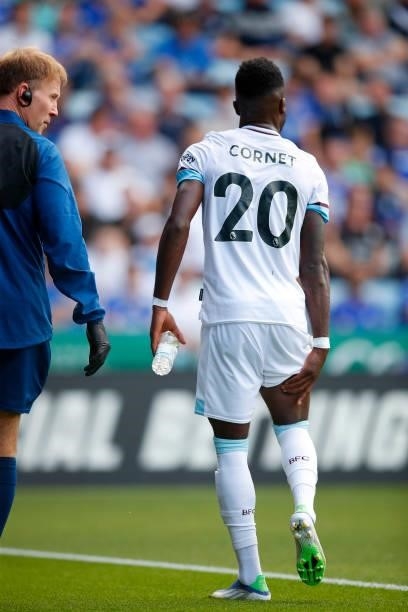 Maxwel Cornet of Burnley leaves the pitch with a hamstring injury during the Premier League match between Leicester City and Burnley at The King...