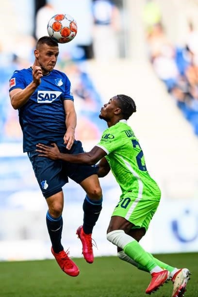 Pavel Kaderabek of TSG Hoffenheim and Ridle Baku of VfL Wolfsburg compete for the ball during the Bundesliga match between TSG Hoffenheim and VfL...