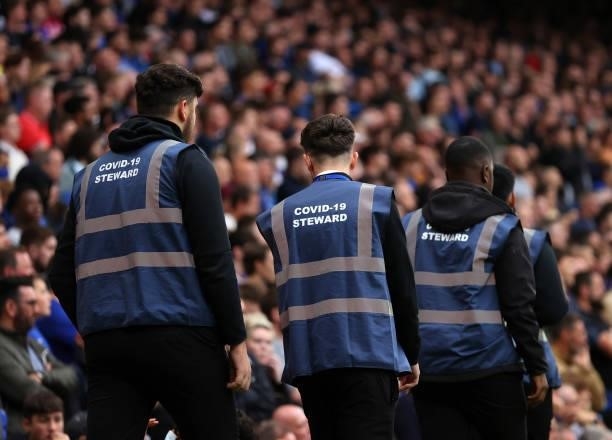 Stewards during the Premier League match between Chelsea and Manchester City at Stamford Bridge on September 25, 2021 in London, England.