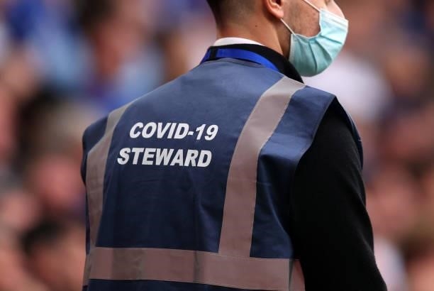 Stewards during the Premier League match between Chelsea and Manchester City at Stamford Bridge on September 25, 2021 in London, England.