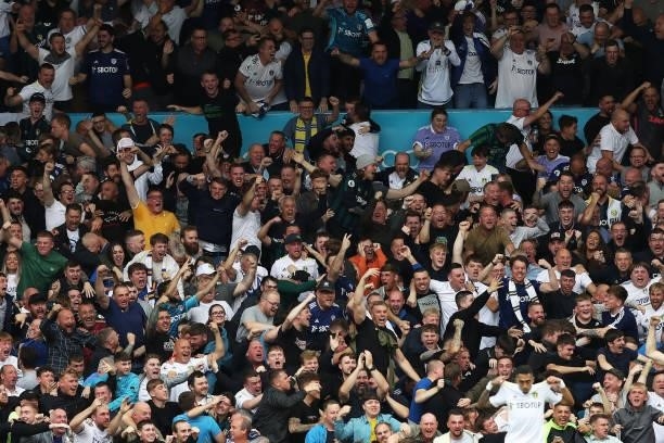Leeds United fans celebrate after their side's first goal scored by Raphinha during the Premier League match between Leeds United and West Ham United...