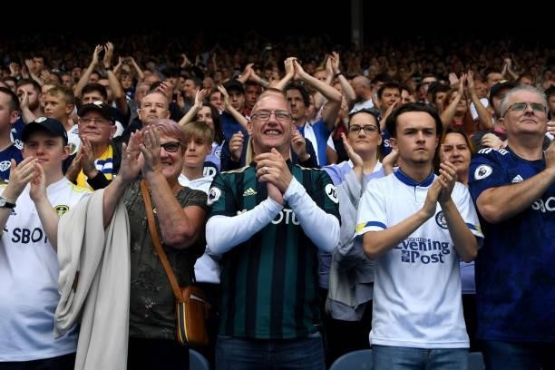 Leeds United fans applaud during the Premier League match between Leeds United and West Ham United at Elland Road on September 25, 2021 in Leeds,...