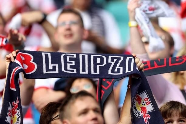 Supporters of Leipzig celebrate during the Bundesliga match between RB Leipzig and Hertha BSC at Red Bull Arena on September 25, 2021 in Leipzig,...