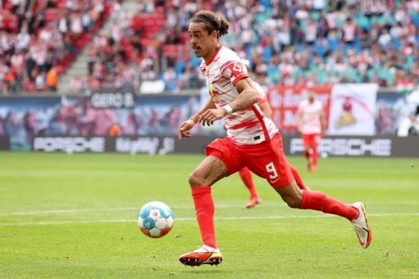 Yussuf Poulsen of Leipzig runs with the ball during the Bundesliga match between RB Leipzig and Hertha BSC at Red Bull Arena on September 25, 2021 in...