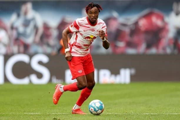Mohamed Simakan of Leipzig runs with the ball during the Bundesliga match between RB Leipzig and Hertha BSC at Red Bull Arena on September 25, 2021...