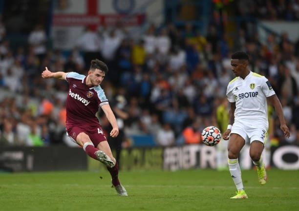 West Ham player Declan Rice crosses to set up the winning goal as Junior Firpo looks on during the Premier League match between Leeds United and West...