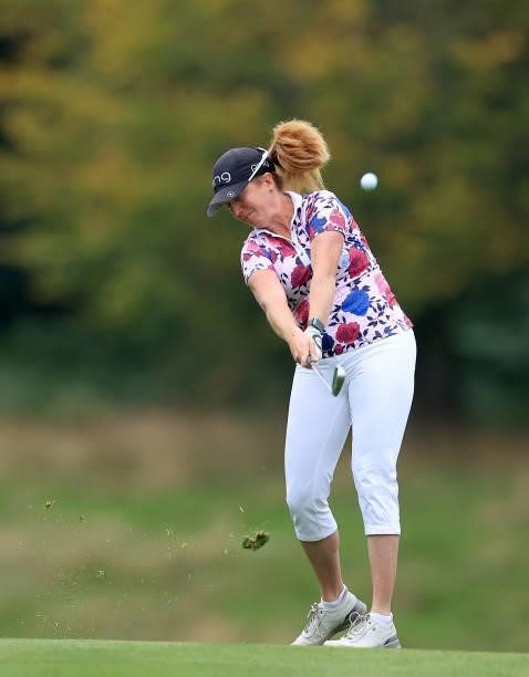 Hannah Burke of England plays her second shot on the 18th hole during the Rose Ladies Series Final at Bearwood Lakes Golf Club on September 25, 2021...