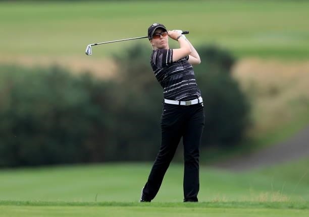 Katrina Gillum of England plays her second shot on the 18th hole during the Rose Ladies Series Final at Bearwood Lakes Golf Club on September 25,...