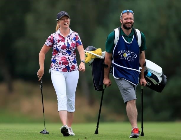 Hannah Burke of England lines up a putt on the 18th hole with her caddie during the Rose Ladies Series Final at Bearwood Lakes Golf Club on September...